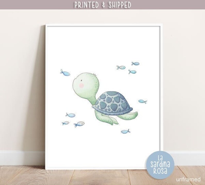 May include: A watercolor illustration of a green sea turtle swimming with blue fish. The turtle has a blue shell and a pink nose. The illustration is on a white background.