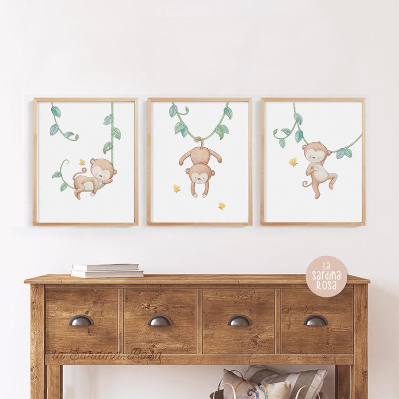 May include: Three framed prints of monkeys swinging on vines. Each print features a different monkey pose and is set against a white background with green vines.