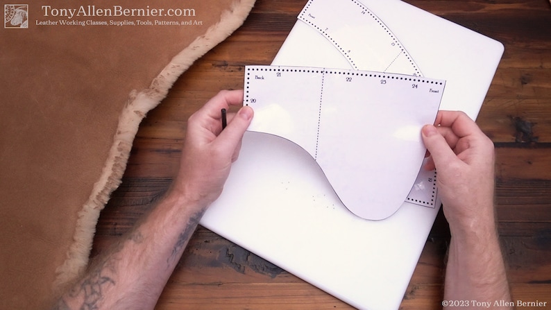 May include: A white paper pattern for a leather project with measurements marked in inches. The pattern is labeled "Back" and "Front".