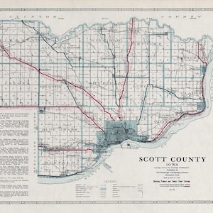 May include: A vintage map of Scott County, Iowa, showing primary and county road systems. The map is dated 1919 and features a detailed grid of townships and roads. The map is printed in blue, red, and black ink on a white background.