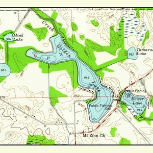 May include: A topographic map of a region with several lakes, including Golden Lake, Tamarack Lake, and Bower Lake. The map shows elevation contours, roads, and other features. The map also includes text labels for the lakes and other features.