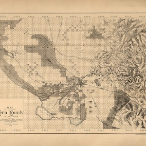May include: A vintage map of Kern County, California, showing the locations of ranches, lakes, rivers, canals, and artesian wells. The map is divided into sections by township and range, and includes a key to the different features.