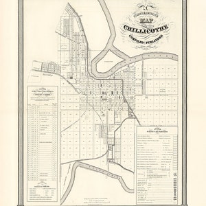 May include: A black and white map of Chillicothe, Ohio, with a detailed grid system and labeled streets. The map includes the Scioto River and Paint Creek, as well as the city's boundaries. The title of the map is "Map of the City of Chillicothe, Compiled and Published by J.H. Young, 1856."