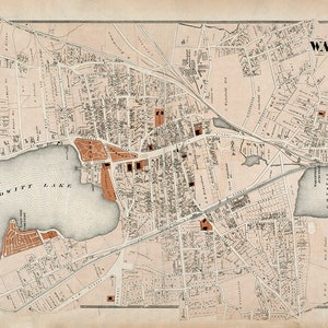 Puede incluir: Un mapa antiguo de Wakefield, Massachusetts, que muestra las calles, edificios y vías fluviales de la ciudad. El mapa está impreso en blanco y negro con resaltados rojos. El mapa incluye el texto "WAKEFIELD, TOWN OF WAKEFIELD, MASS."