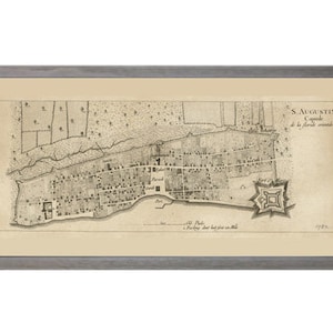 May include: A vintage map of St. Augustin, the capital of la Florida, printed in 1763. The map shows the city's layout with streets, buildings, and the fort.