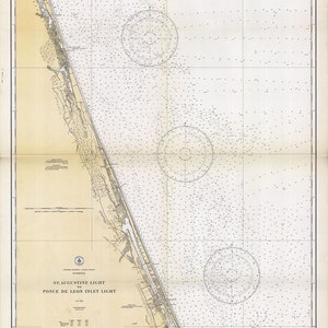 May include: A vintage nautical chart of the coastline of Florida from St. Augustine Light to Ponce de Leon Inlet Light. The chart is printed on a cream-colored paper with black and blue lines. The chart includes a compass rose and depth soundings.