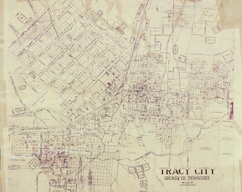 May include: A vintage map of Tracy City, Grundy County, Tennessee. The map shows the layout of the city with streets, blocks, and property lines. The map is printed in red ink on a cream-colored paper.