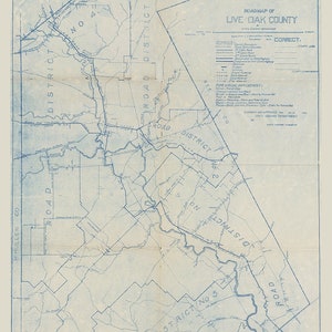 May include: A blue and white map of Live Oak County, Texas, showing road districts and county boundaries. The map is titled "Road Map of Live Oak County" and includes a legend with symbols for different types of roads and road improvements.