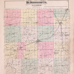 May include: A vintage map of McDonough County, Illinois, showing the county's townships and roads. The map is divided into squares, each representing a township. The map is printed in black and white, with some areas shaded in light green, pink, and yellow. The map includes the names of the townships and the county seat, Macomb.