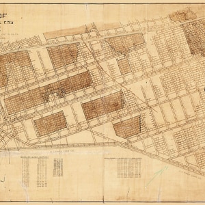 May include: A vintage map of the "Frisky Funk City Mine" with a grid layout of lots and streets. The map is printed on aged paper with brown ink and includes a table of "Base of Lot Survey" with numbers.