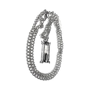 May include: A silver chain necklace with an hourglass pendant.