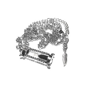 May include: A silver chain necklace with an hourglass pendant and a small feather charm.