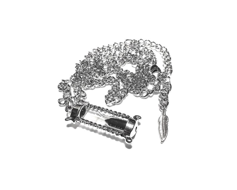 May include: A silver chain necklace with an hourglass pendant and a small feather charm.