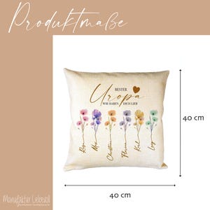 May include: A beige square pillow, 16 inches in size, with floral illustrations and text. The pillow features the words "BEST Uropa" and "WIR HABEN DICH LIEB" in gold script. Below are colorful flower illustrations and names.