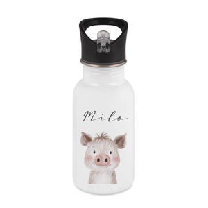 May include: White water bottle with a black lid featuring a cartoon pig illustration. The pig has pink cheeks and a pink nose. The name "Milo" is written in cursive above the pig.