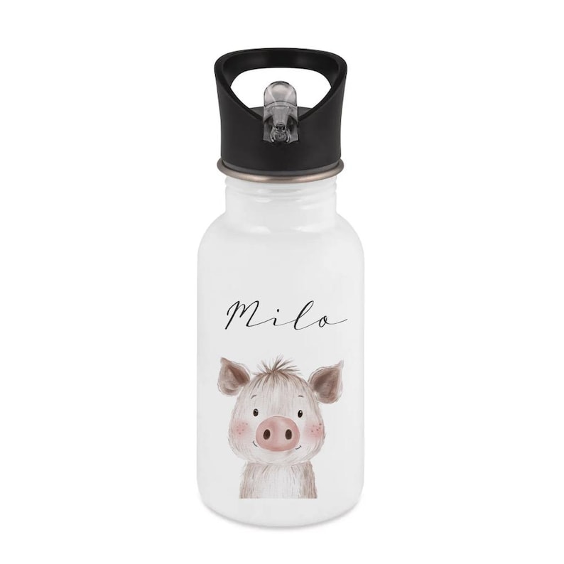 May include: White water bottle with a black lid featuring a cartoon pig illustration. The pig has pink cheeks and a pink nose. The name "Milo" is written in cursive above the pig.