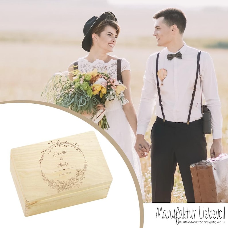 May include: A wooden box with an engraved floral design and the text "Janette & Micha 1. Mai 2023". The box is light brown and has a lid.