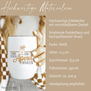 May include: White stainless steel tumbler with the text "Kann Spuren von Aperol enthalten" and a cocktail illustration. The tumbler is 11.5 cm tall, 8.5 cm in diameter, and holds 350 ml. It weighs approximately 200 g.