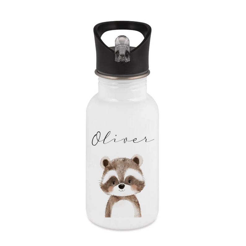 May include: White water bottle with a black lid and a raccoon illustration. The name "Oliver" is written in cursive above the raccoon. The raccoon is brown, white, and tan.