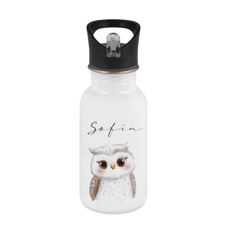May include: White water bottle with a black lid and a cute owl illustration. The name "Sofia" is written in cursive above the owl. The bottle is designed for kids and has a flip-top lid.