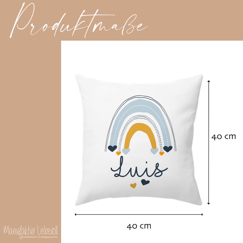May include: White square pillow with a rainbow design in blue, yellow, and gray. The rainbow has a dotted outline and is topped with five small hearts in navy blue and orange. The name "Luis" is written in black below the rainbow. The pillow measures 40 cm by 40 cm.