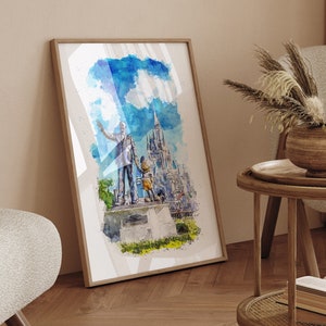 May include: A watercolor painting of a couple standing in front of a castle, framed in a brown wood frame. The painting is hanging on a wall in a living room with a side table and a chair.