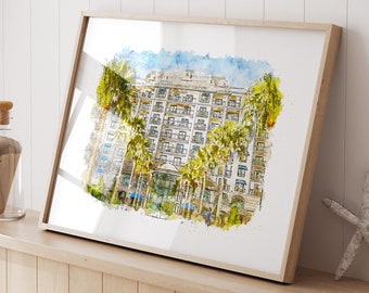 Pode incluir: Uma pintura em aquarela de um prédio de hotel com palmeiras na frente. O prédio é branco com detalhes azuis e tem muitas janelas. As palmeiras são verdes e têm um ambiente tropical. A pintura está emoldurada em uma moldura de madeira.
