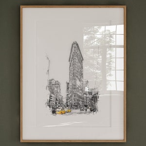 Puede incluir: Un boceto en blanco y negro del Flatiron Building en la ciudad de Nueva York con taxis amarillos en primer plano.