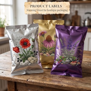 May include: Three metallic snack bags in silver, gold, and purple, each featuring a botanical illustration of flowers and berries resting on stones. The silver bag displays red poppies, the gold bag shows pink coneflowers, and the purple bag depicts lavender.