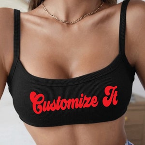 May include: Black ribbed tank top with red "Customize It" text in a retro font.
