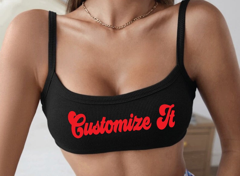 May include: Black ribbed tank top with red "Customize It" text in a retro font.