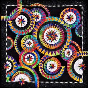 May include: A black fabric quilt with a colorful geometric design. The quilt features a repeating pattern of circles and stars in shades of red, orange, yellow, green, blue, purple, and white.