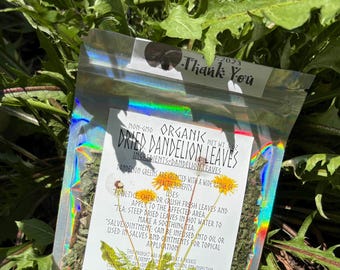 May include: A holographic pouch containing dried dandelion leaves with a label reading Non-GMO Organk Dried Dandelion Leaves, Net Wt .5 oz, and Stardast Homestead, Maynardville, TN, featuring instructions for poultice, tea, and salve applications.