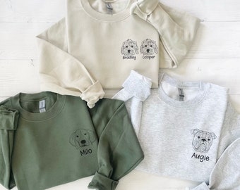 May include: Four sweatshirts with different dog breeds and names embroidered on the front. The sweatshirts are in various colors, including beige, green, and gray.