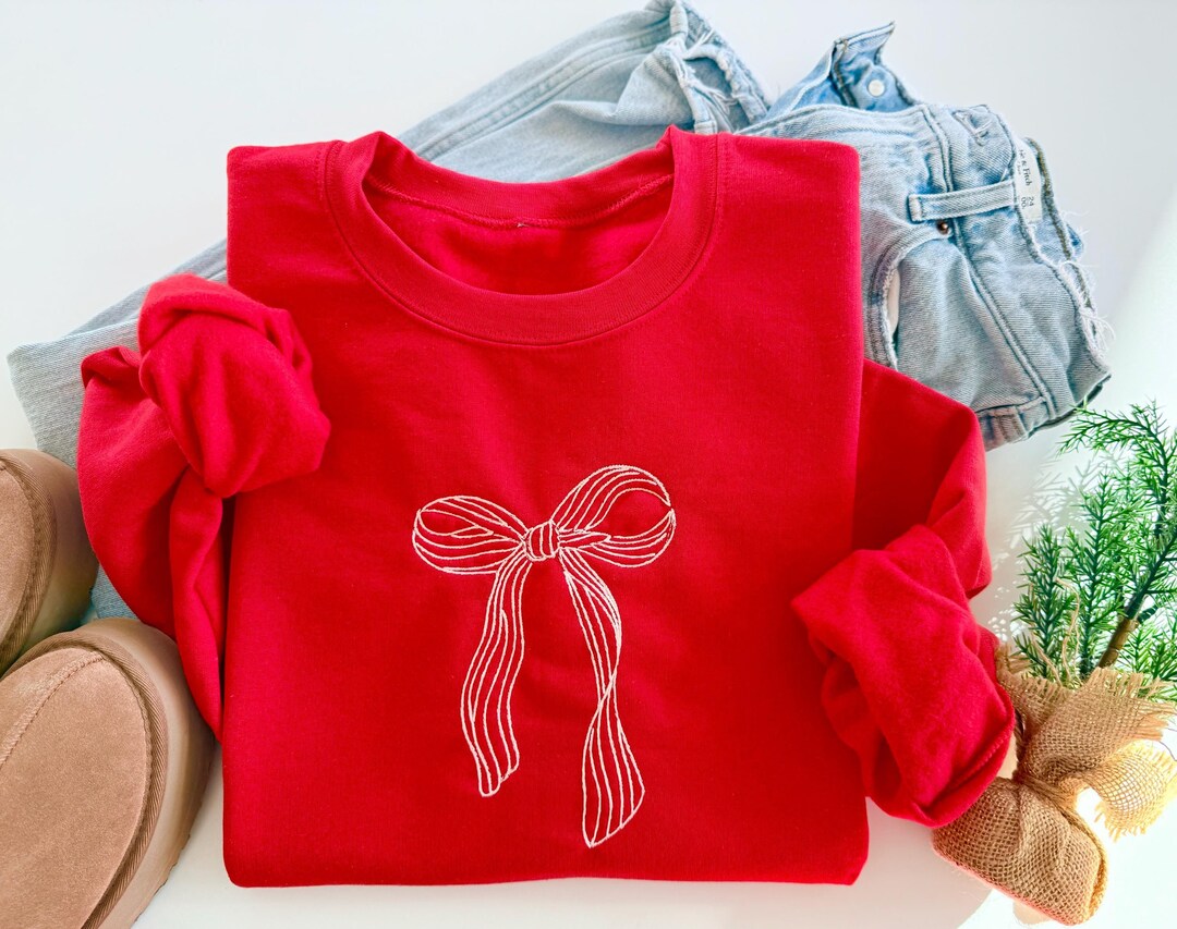 SO ME Wrapped In Sequins Bow Ribbon Embellished Christmas Sweater in Black/Red