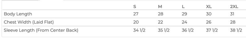 May include: Size chart for a garment with measurements in inches for body length, chest width, and sleeve length. Sizes include S, M, L, XL, and 2XL.