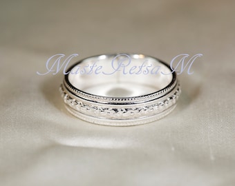 102120    925    Silver pattern ring,        5.6 mm width