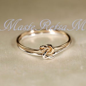 Two tone double knot       gold + Sterling ,