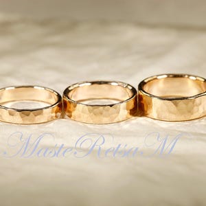 May include: A white ceramic mug with a black handle and the text "But First, Coffee" in a black, handwritten-style font. The mug is on a white surface.