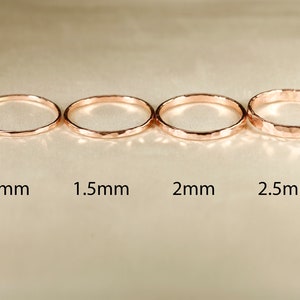 May include: Four hammered gold rings in different sizes: 1mm, 1.5mm, 2mm, and 2.5mm.