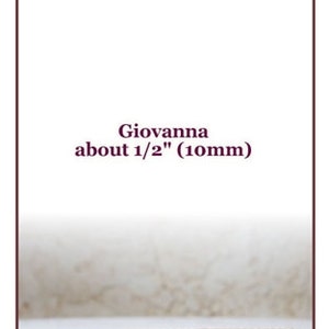 May include: A close-up of a brown leather strap, about 1/2 inch (10mm) wide, labelled "Giovanna".