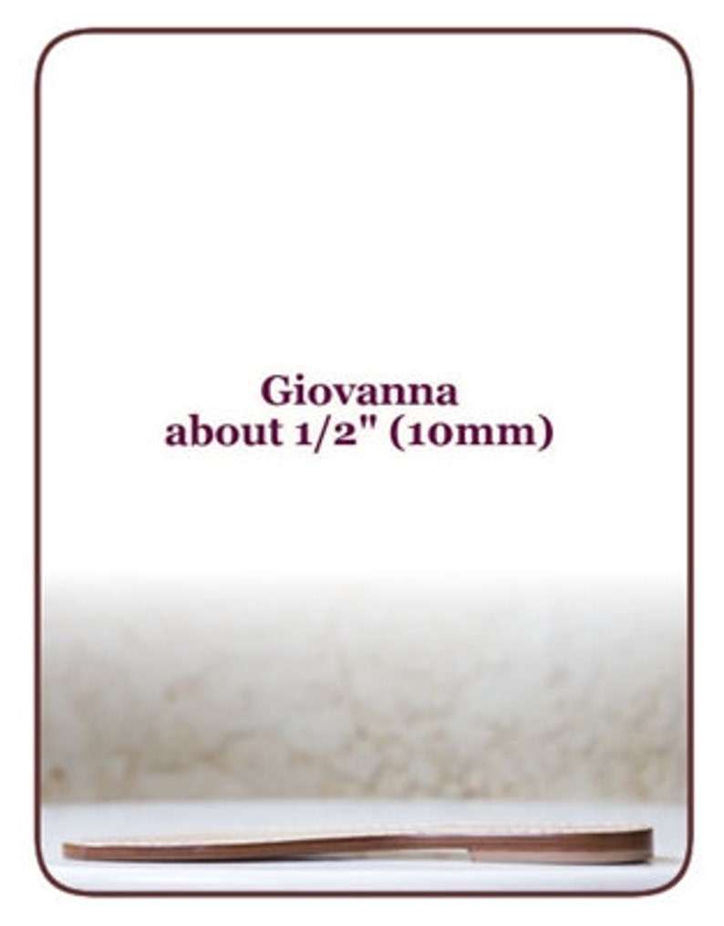 May include: A close-up of a brown leather strap, about 1/2 inch (10mm) wide, labelled "Giovanna".