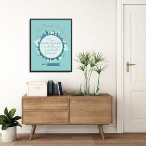 May include: A framed wall art print with a light blue background featuring a circular silhouette of global landmarks and the text To Travel is to Live, to breathe, to fly, to float, to gain all while you give, to roam the roads of lands remote.
