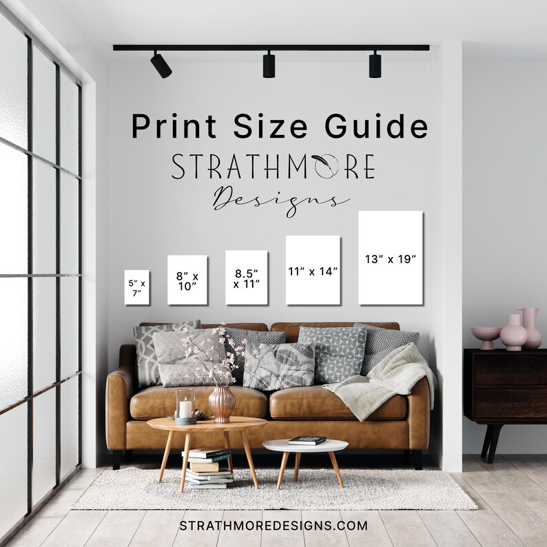 May include: A Print Size Guide by Strathmore Designs featuring five white rectangular frames on a wall above a brown leather sofa. The frames are labeled with dimensions: 5" x 7", 8" x 10", 8.5" x 11", 11" x 14", and 13" x 19". The website is strathmoredesigns.com.