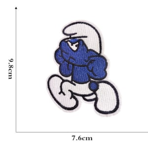 May include: Embroidered patch featuring a blue cartoon character with white accents and a white hat. The patch is 9.8cm tall and 7.6cm wide. The character is in a running pose with an angry expression. The patch has a white border.