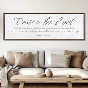 May include: A rectangular wall sign with a dark brown frame and a white background featuring a distressed wood texture. The text reads: Trust in the Lord with all your heart and lean not on your own understanding; in all your ways acknowledge him, and he will make your paths straight. Proverbs 3:5-6.