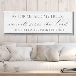 May include: A rectangular white wooden wall sign with a distressed finish and a dark gray border. The text reads: AS FOR ME AND MY HOUSE we will serve the Lord THE MILLER FAMILY • ESTABLISHED 2024 in a mix of serif and script fonts.