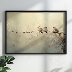 May include: A framed painting of three brown birds perched on a branch. The background is a light beige with a soft, blurry effect. The birds are facing the right side of the image.