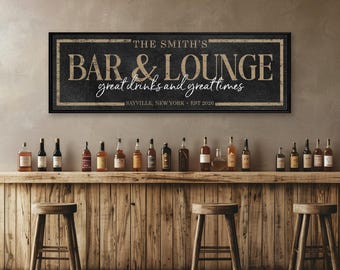 May include: A rectangular wall sign with a black textured background and a beige border. The text reads THE SMITH'S BAR & LOUNGE, great drinks and great times, SAYVILLE, NEW YORK, EST 2026. The sign is framed in a thin black border.