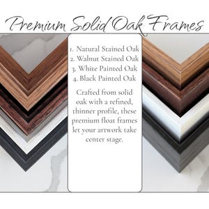 a collection of premium solid oak frames, each with a different color and finish, arranged in a visually appealing manner.
